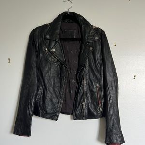 Black leather jacket with star detail in the back